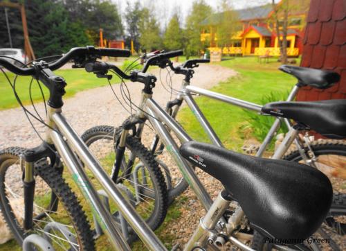 a group of bikes parked next to a house at Hotel y Cabañas Patagonia Green in Puerto Aisén