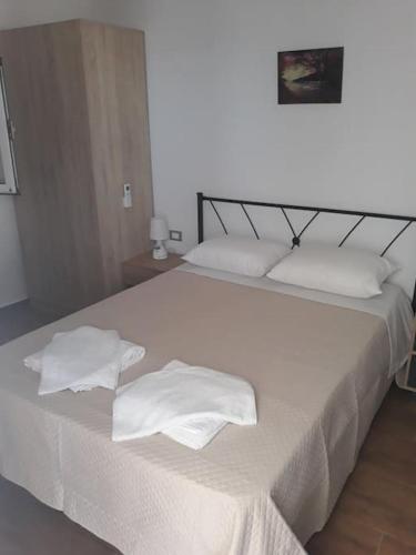 Posteľ alebo postele v izbe v ubytovaní CASA TONIA