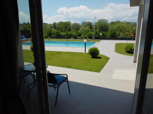 a view of a pool from the balcony of a house at Villa Dimo Topal in Ohrid