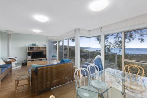 a living room with a view of the ocean at Beach Bush and Birds in Lorne