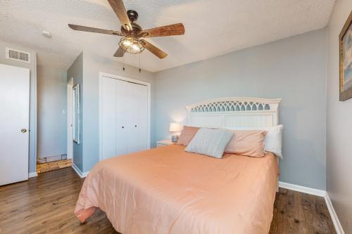 a bedroom with a bed and a ceiling fan at Sea Breeze #312 in Gulf Shores