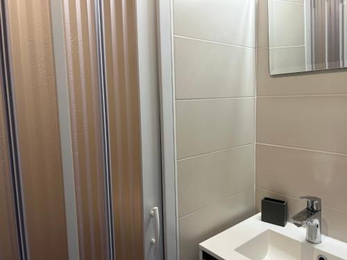 a bathroom with a sink and a shower at Génépis - Studio rénové Tignes Val Claret 4 pax in Tignes