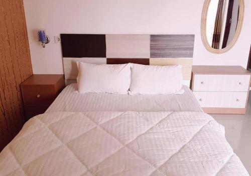 Ένα ή περισσότερα κρεβάτια σε δωμάτιο στο JOBO Guest House 4BR