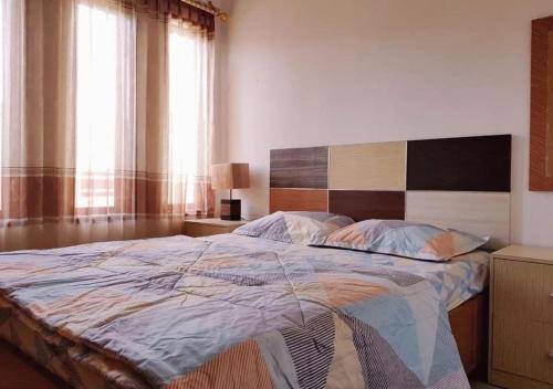 Ένα ή περισσότερα κρεβάτια σε δωμάτιο στο JOBO Guest House 4BR