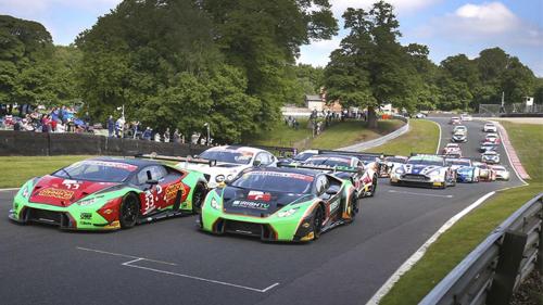 a group of cars lined up on a race track at Oulton Park Lodge in Little Budworth