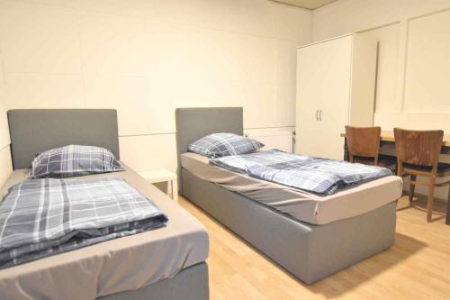 Cama ou camas em um quarto em Monteurzimmer mit Pantry-Küche in Köln