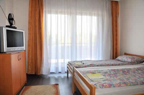 En eller flere senger på et rom på Hostel Room