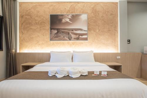 Postel nebo postele na pokoji v ubytování Tarnsiri Boutique Resort