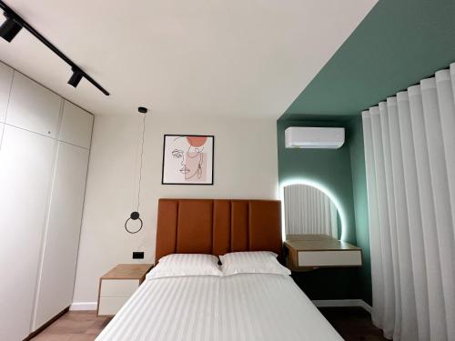 Ένα ή περισσότερα κρεβάτια σε δωμάτιο στο Dolce far niente Apartment