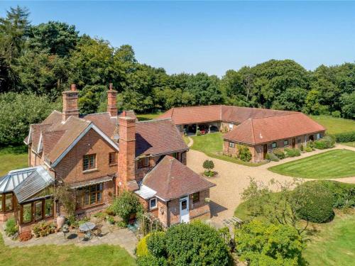 an aerial view of a large brick house at Holly Lodge Country Guest House in Blidworth