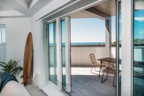 a balcony with a view of the ocean from a house at Luxury Family Apartment with sea views in Newquay
