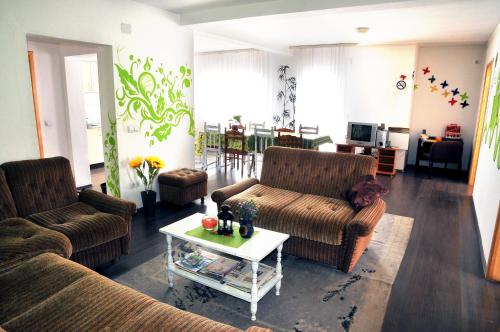 a living room with two couches and a coffee table at Hostel Room in Banja Luka