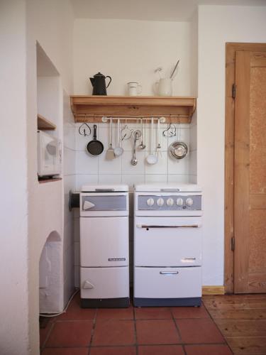 a kitchen with two ovens and a sink at Aigen 13 - Dreiviertelhof im Waldviertel in Aigen
