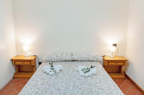 a bedroom with a bed with two night stands at Il Casale di Marnino in Cremia