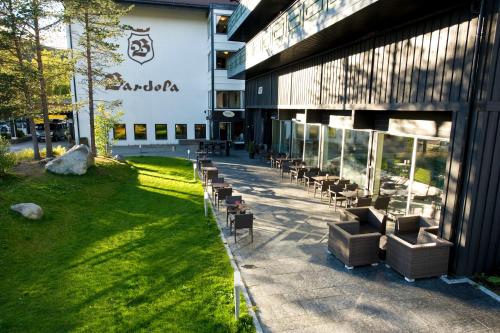 a group of chairs sitting outside of a building at Bardøla Fjelltun in Geilo