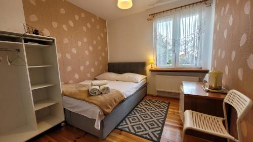 Posteľ alebo postele v izbe v ubytovaní Pokoje Żabi Staw