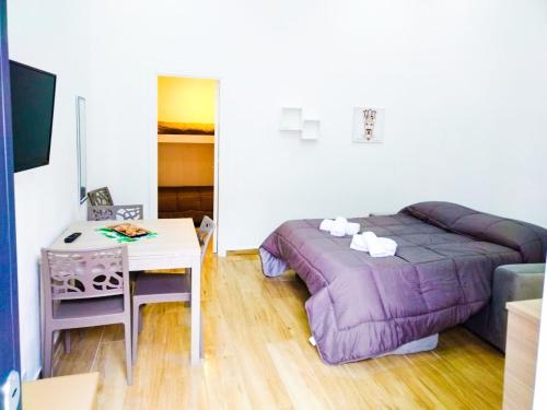 En eller flere senge i et værelse på IGIEA ROOMS