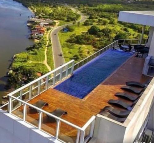 an upper deck of a cruise ship with a swimming pool at Paiva Home Stay Aptº temporada in Recife