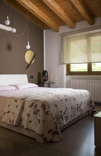 Ένα ή περισσότερα κρεβάτια σε δωμάτιο στο La Casa di Emy