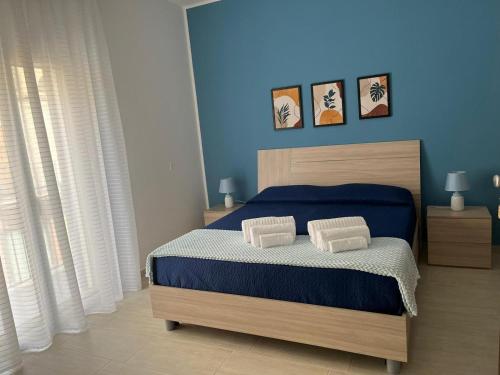Ένα ή περισσότερα κρεβάτια σε δωμάτιο στο B&B Alessia