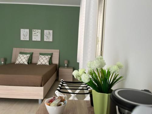 Ένα ή περισσότερα κρεβάτια σε δωμάτιο στο B&B Alessia