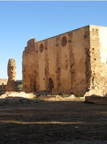a large brick building in the middle of a field at MASÍA de SAN JUAN CASA NÚMERO 1 en Castillo con piscina y Aire Acondicionado in Segorbe