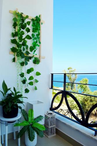 a window with a view of the ocean at Magnificent sea view,clean and bright apartments in Kalathas