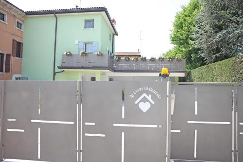a pair of metal gates in front of a building at Al Cuore di Valeggio in Valeggio sul Mincio