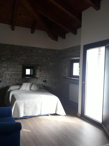 Postel nebo postele na pokoji v ubytování LAS CASINAS DE ARBAZAL