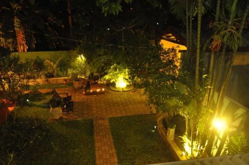 a garden at night with lights in the yard at Green Villa Unawatuna in Unawatuna
