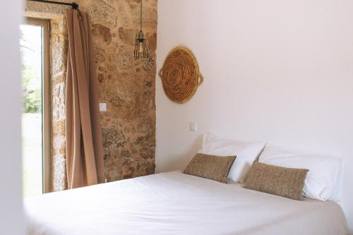 Tempat tidur dalam kamar di Quintal Country Houses