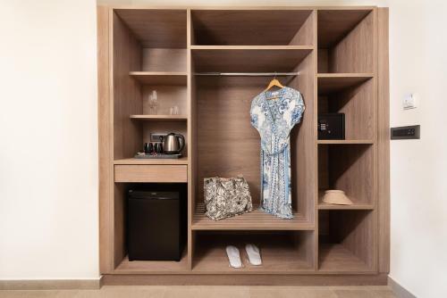 a dress on a shelf in a room at Ixia Dream hotel - Adults only in Ixia