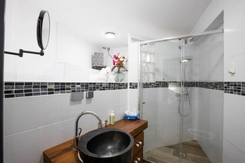 a bathroom with a sink and a shower at Villa Bel Amour, luxury and awesome sea view in Upper Prince's Quarter