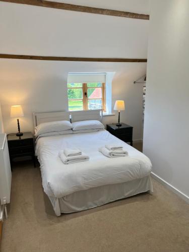 A bed or beds in a room at Heath House Farm