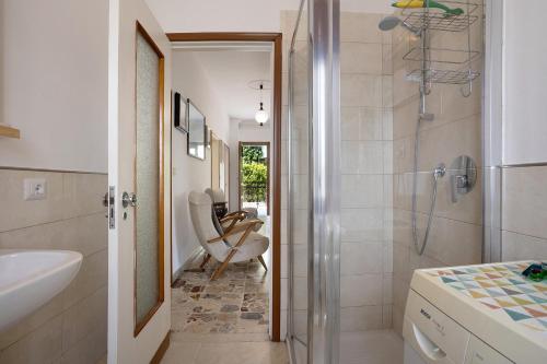 a bathroom with a shower and a sink at Villa Carolina in San Felice del Benaco
