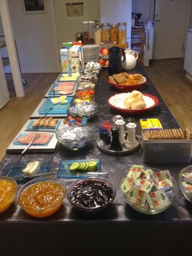 a table topped with lots of food on top at Give Bed & Breakfast in Give