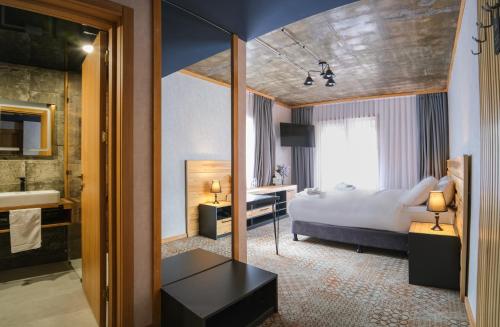 Postel nebo postele na pokoji v ubytování Hotel Posta