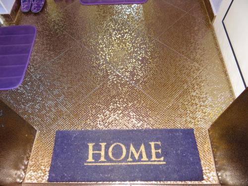 a home sign on top of a floor with glitter at Orange Flower Apartments 1 in Sofia