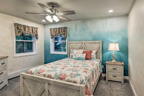 a bedroom with a bed and a ceiling fan at Cozy Seneca Falls Home Close to Cayuga Wine Trail! in Seneca Falls