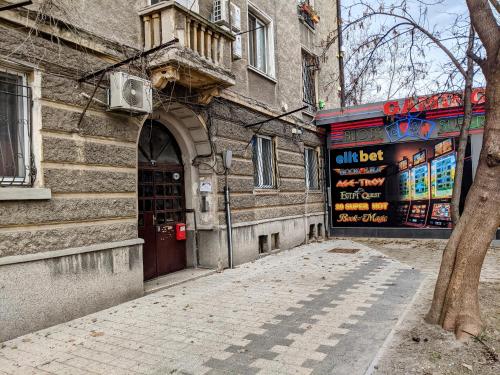 an empty alley in front of a building at Small cozy apartment near the center of Plovdiv in Plovdiv