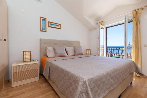 Ένα ή περισσότερα κρεβάτια σε δωμάτιο στο Apartments Paloc - Orange