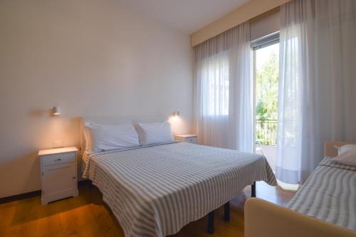 Postel nebo postele na pokoji v ubytování Hotel Janeiro