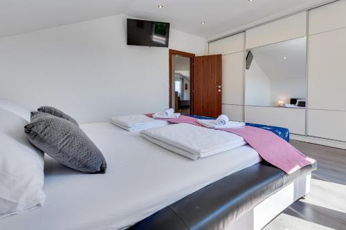 Posteľ alebo postele v izbe v ubytovaní Apartman ViEw