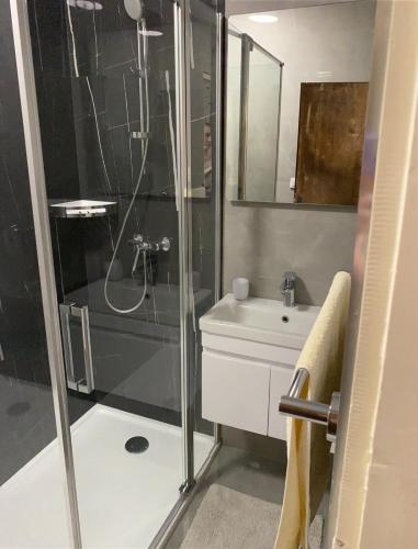 a bathroom with a shower and a sink at Apartments Sunce in Mlini