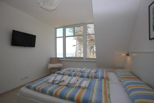 Кровать или кровати в номере Stockmannsweg 14_ Whg_5 Haus am Me