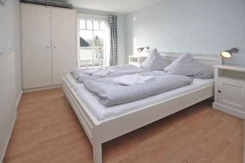 Ένα ή περισσότερα κρεβάτια σε δωμάτιο στο Wiesenweg 4a, Whg 2