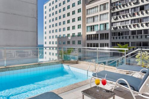 a swimming pool on the roof of a building at Windsor Martinique Copacabana in Rio de Janeiro