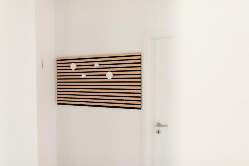 a door with a vent on the side of it at Küsten Suite Nord - direkte Wasserlage, Terrasse, 70qm in Greetsiel