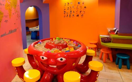 a childs play room with a childs toy table at L'Hôtel Québec par JARO in Quebec City