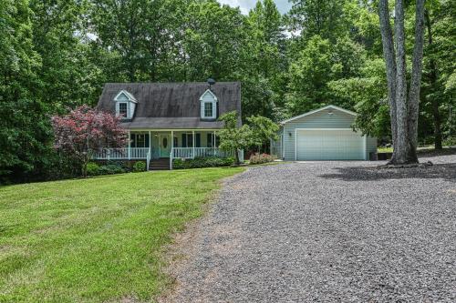 a house with a driveway and a garage at Total Escape in Mineral